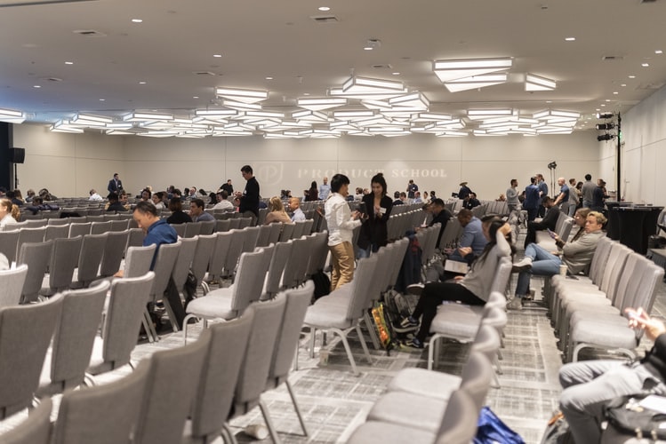 A meeting takes place in a conference room equipped with ASI Architectural acoustic ceiling tiles.