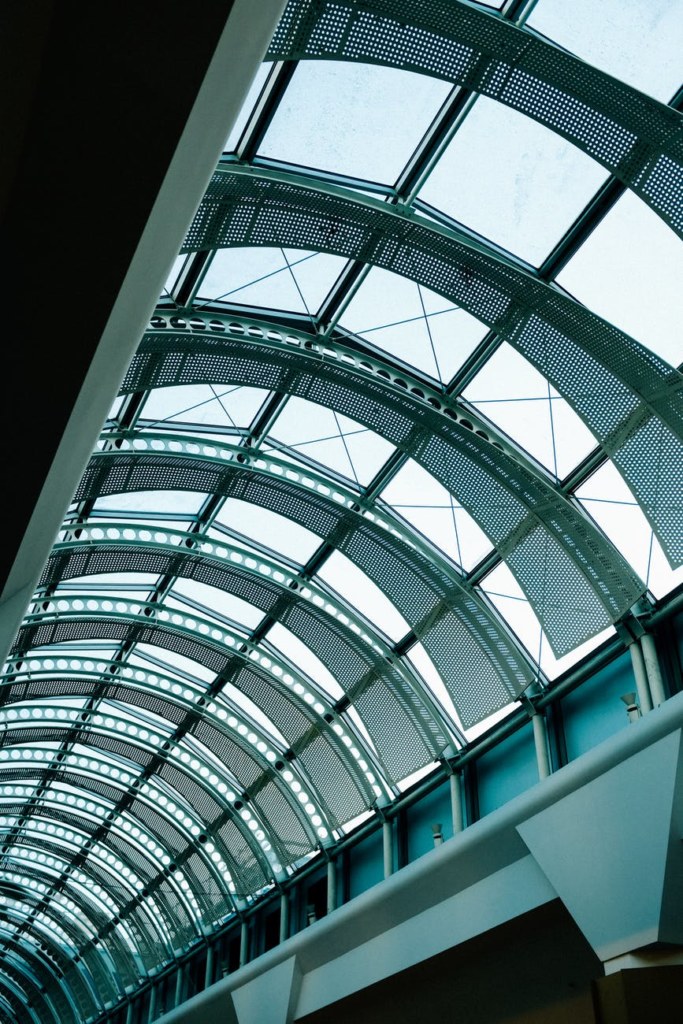 ASI Architectural miroperf metal ceiling reduces sound in a busy airport terminal.