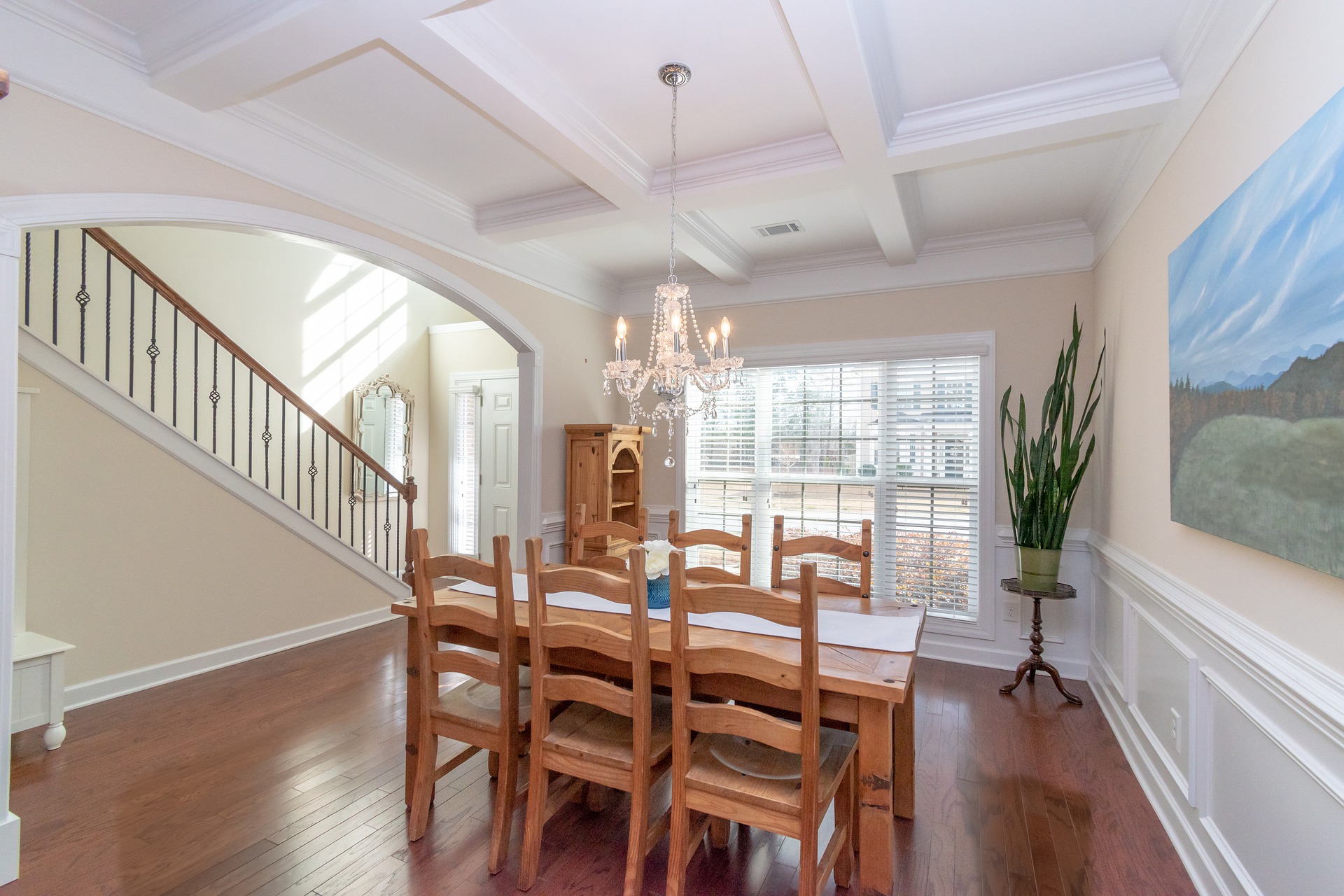 A coffered ceiling made of ASI Architectural wooden beams improves the acoustics of a dining room in a luxury residence