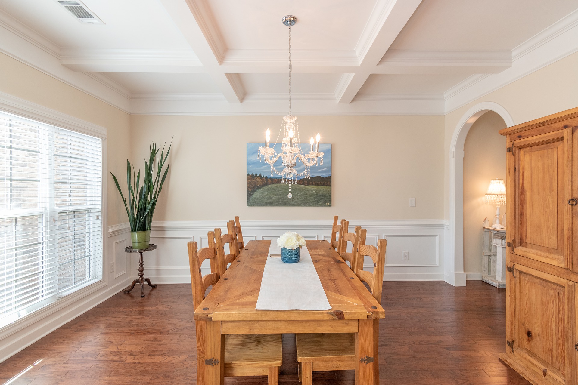 A cozy home is equipped with ASI Architectural Wood Coffered Ceiling to improve the acoustics of the dining room.