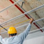 Measuring distance and planning the armstrong ceiling installation with acoustic panels With professional technicians